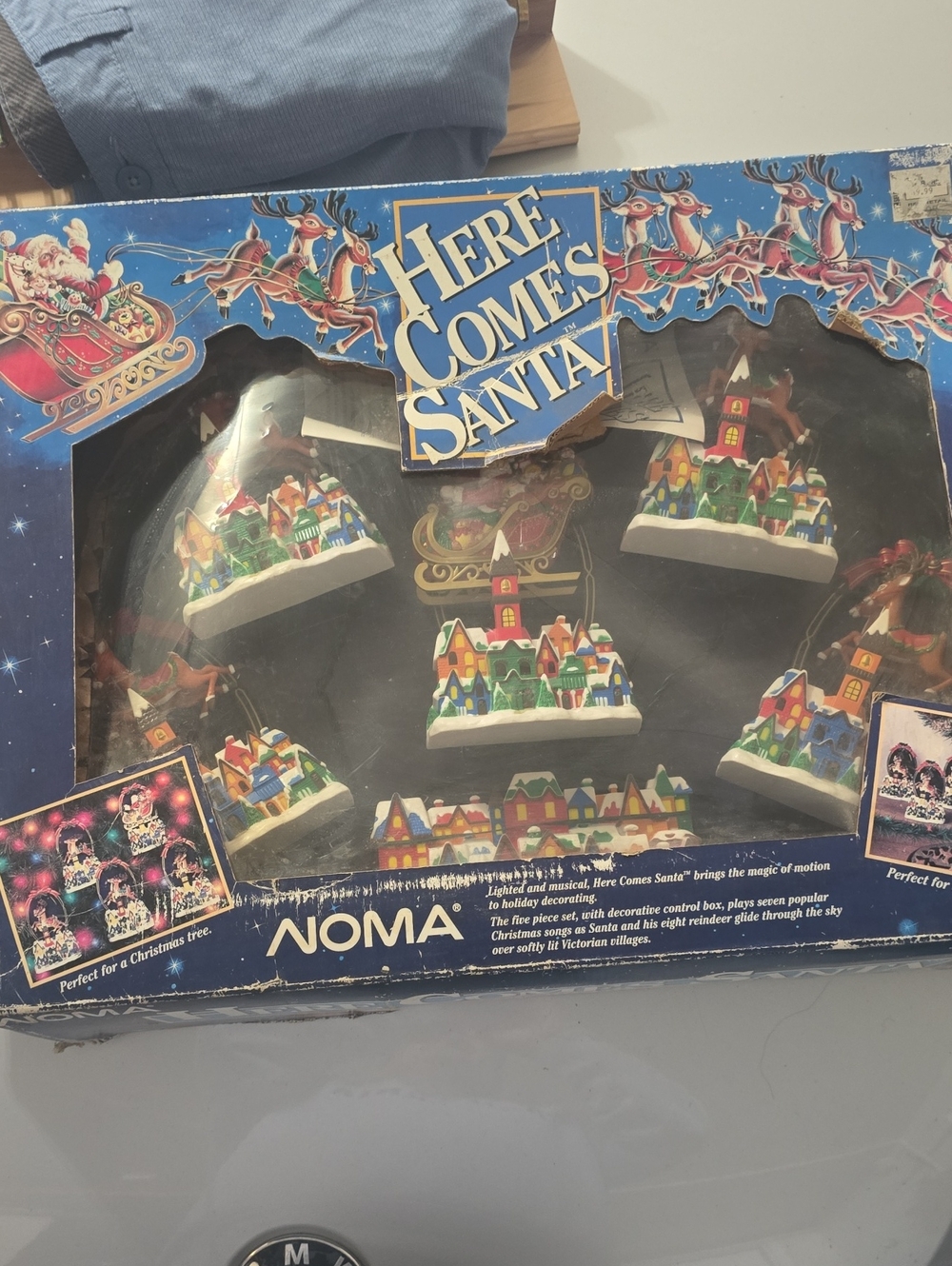 NOMA Here Comes Santa Christmas Village Ornaments - White, Red, Green, Blue